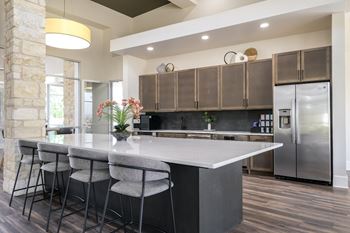 resident social area with demonstration kitchen at The Allure apartments
